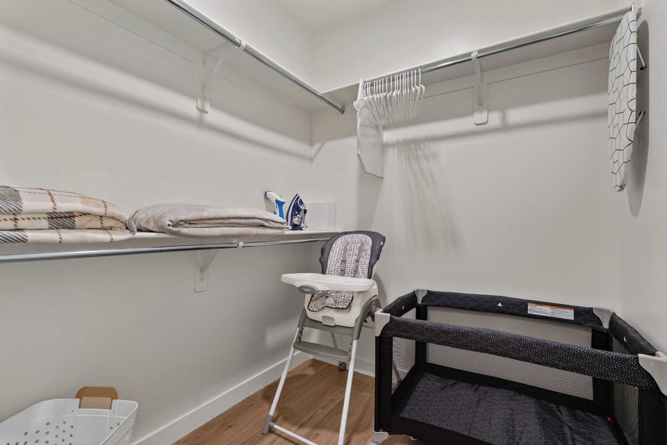 Spacious Walk-In Closet with Baby-Friendly Setup, Pack ‘n Play & High Chair. Perfect for Families, Easy Unpacking, and Comfortable Extended Stays