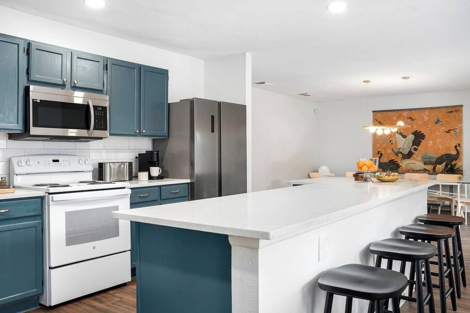 Have a few drinks at the kitchen island while watching the designated chef in action.
