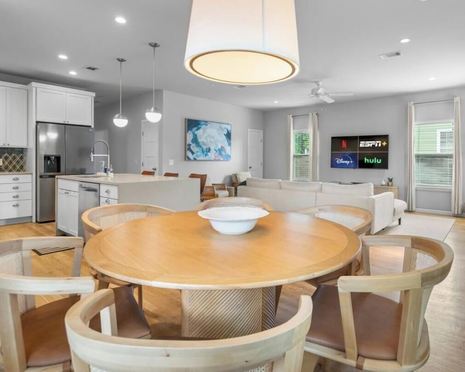 One connected space for cooking, dining, and relaxing. The open floor plan keeps the whole group together.