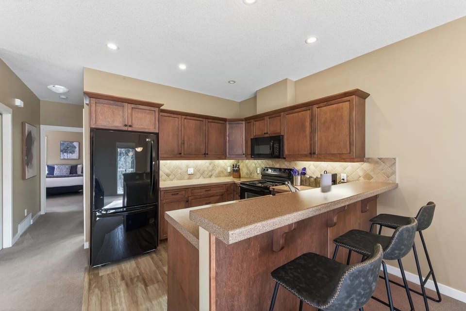 Full kitchen with a drip coffee machine, ground coffee, tea, sugar and basic condiments (ketchup, mustard and relish.)