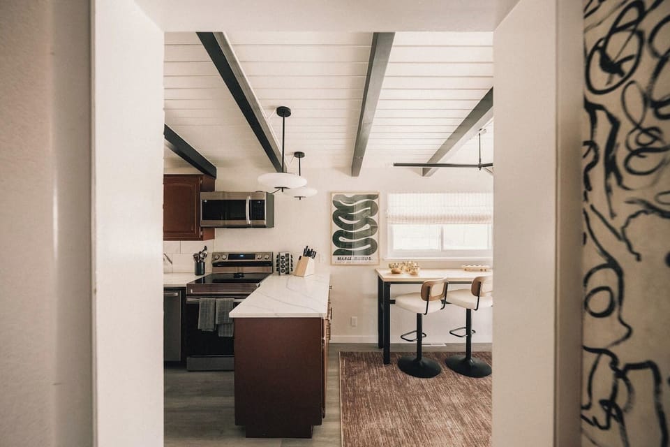 The Kitchen - Fully stocked kitchen with modern finishes and clean design.
