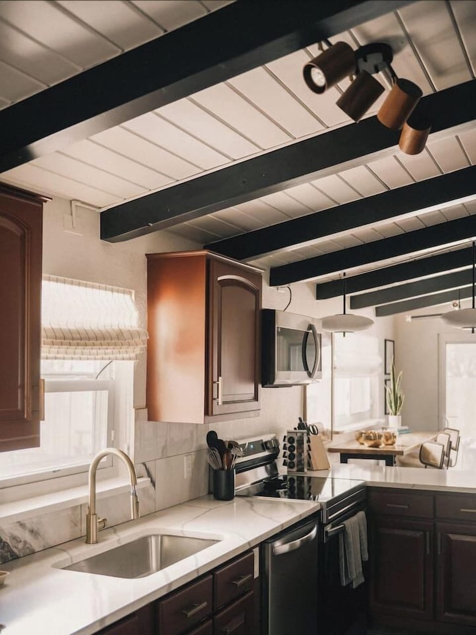 The Kitchen - Fully stocked kitchen with modern finishes and clean design.