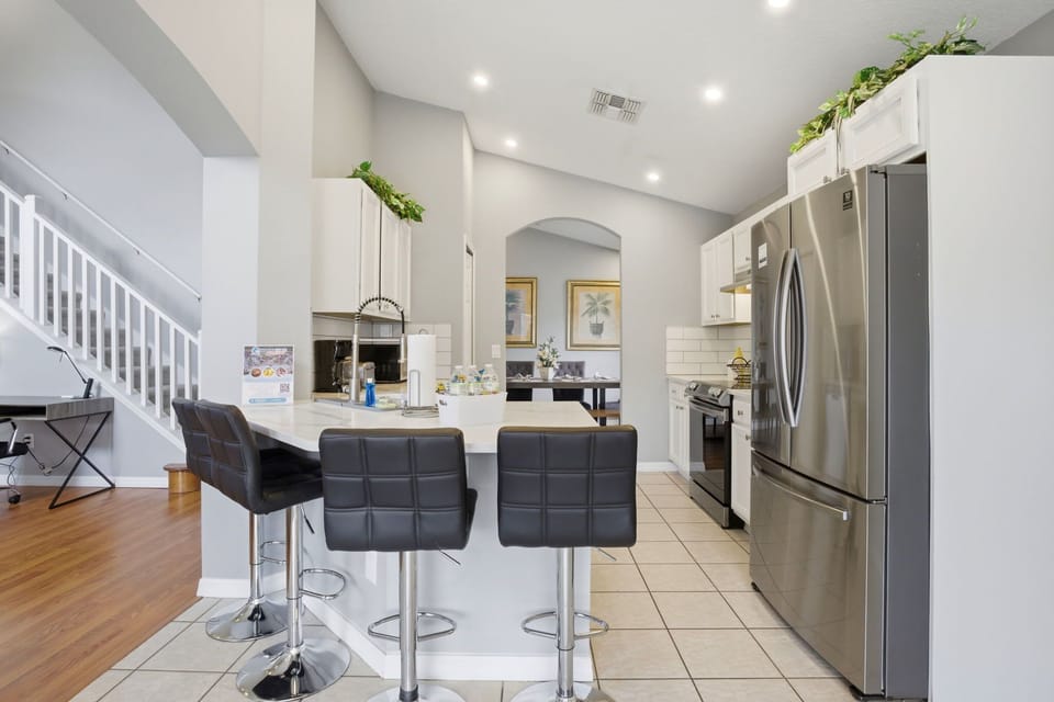 Cook, snack, or sip your morning coffee at the spacious breakfast bar with seating for the whole crew.