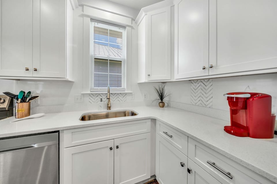 Clean up is fast with the quiet dishwasher. We provide detergent pods right under the sink.