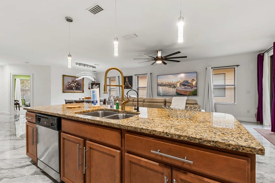 Stunning granite kitchen island with sink & pendant lighting