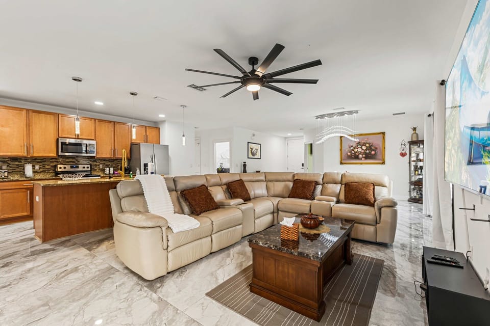 Modern living room with large sectional sofa & open kitchen