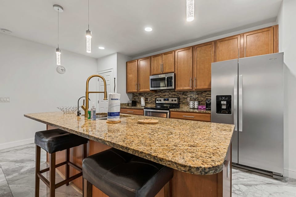 Modern Kitchen with Granite Island & Stainless Appliances