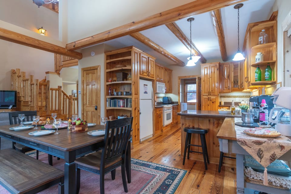 Open concept living, kitchen and dining areas