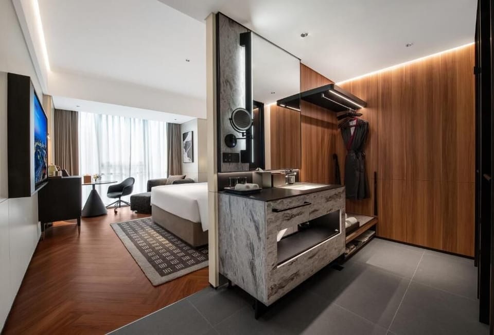 Premium bedding, down comforters, memory foam beds, free minibar