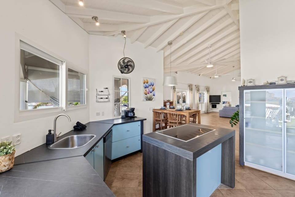 Open kitchen with island seating fully equipped for easy island living