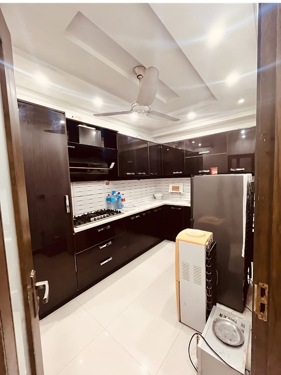 Fridge, stovetop, cookware/dishes/utensils, cleaning supplies