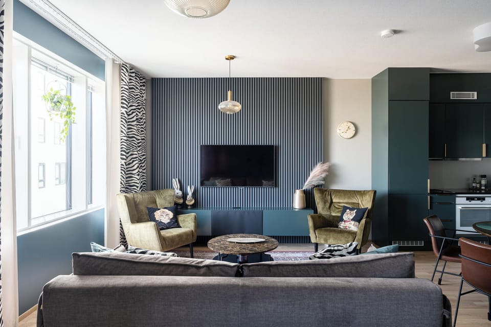 Superior Apartment, Air conditioning, City View | Living area | 55-inch TV with cable channels, heated floors