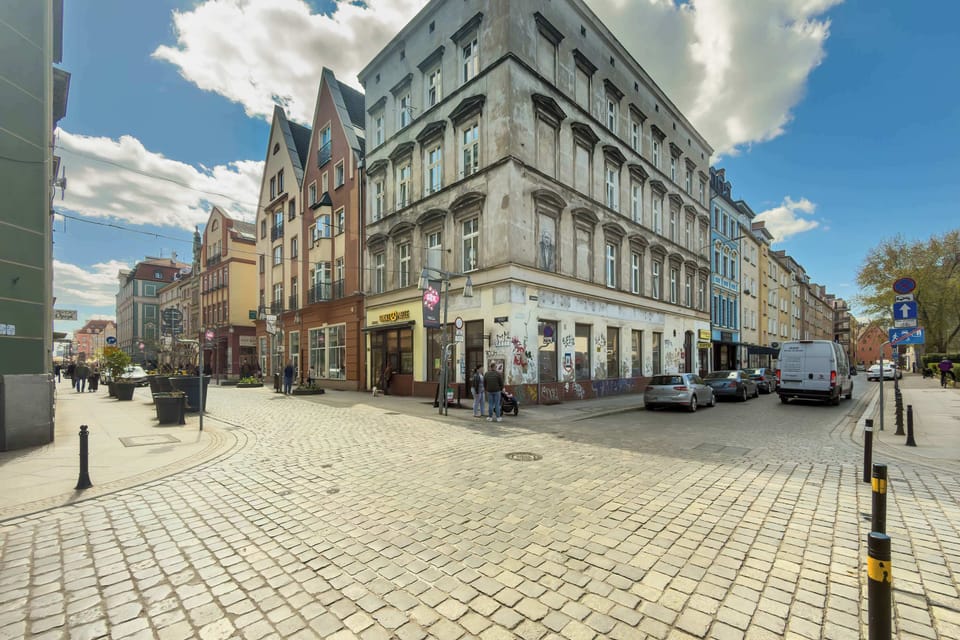 Another street view of a historic city corner with beautiful architecture. The scene highlights the charm of the surrounding area.