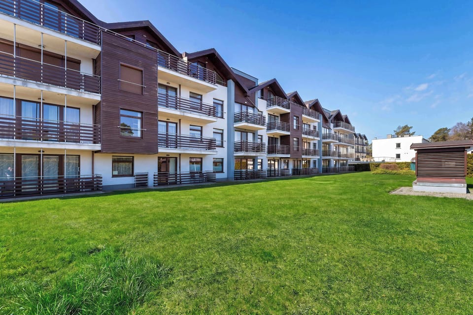 Another perspective of the residential complex with landscaped greenery. The area appears peaceful and well-kept.