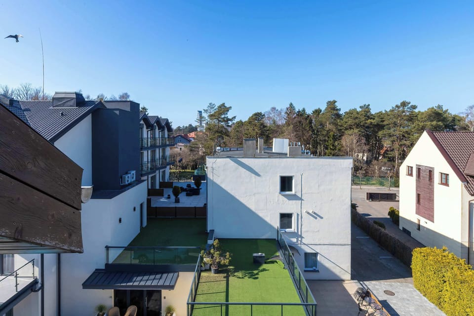 A second balcony angle showing the railing and outdoor seating area. It is designed for comfortable outdoor relaxation.