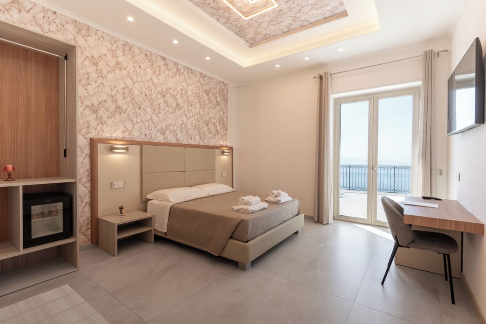 Room, Sea View (Cancer) | Minibar, desk, WiFi (free), bed sheets