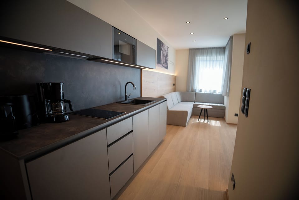Deluxe Apartment, 2 Bedrooms | Private kitchen | Fridge, microwave, stovetop, dishwasher