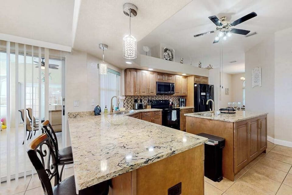 Kitchen includes a starter kit with essentials such as dish soap, detergent, trash bags, toilet paper, and paper towels. Guests are responsible for additional supplies.