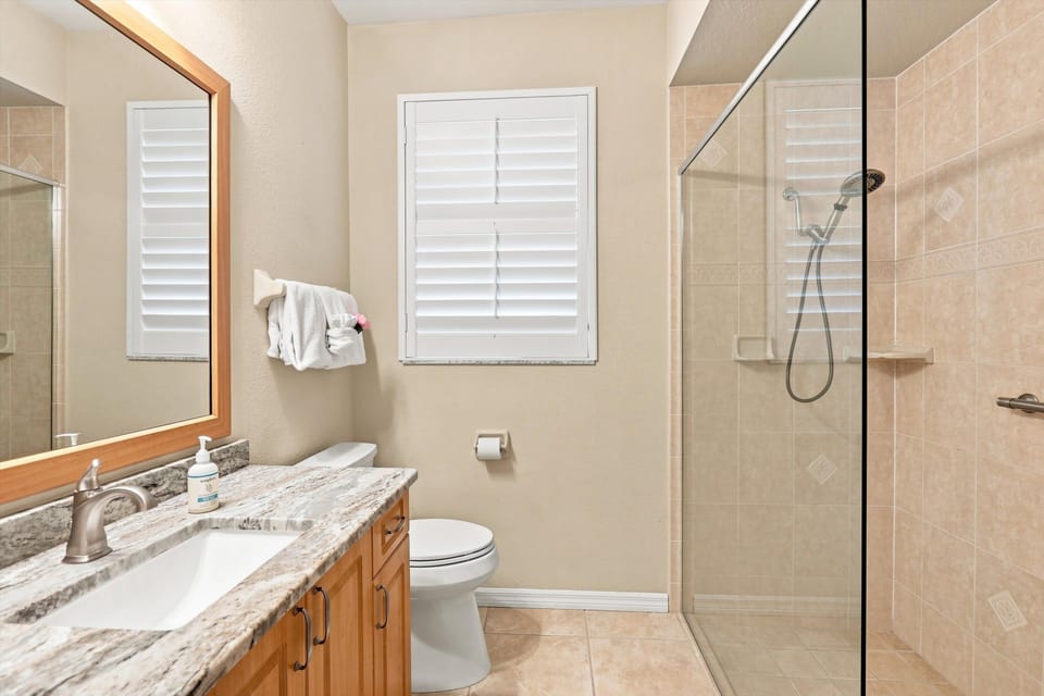 Clean and inviting guest bathroom featuring a functional layout and comfortable space for visitors.