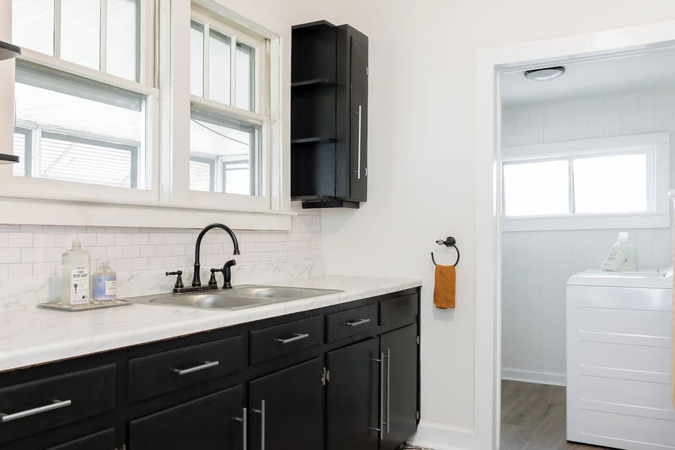 Kitchen located near the entrance of the home and adjacent to the laundry room.