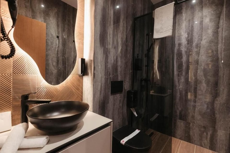 Shower, free toiletries, hair dryer, slippers