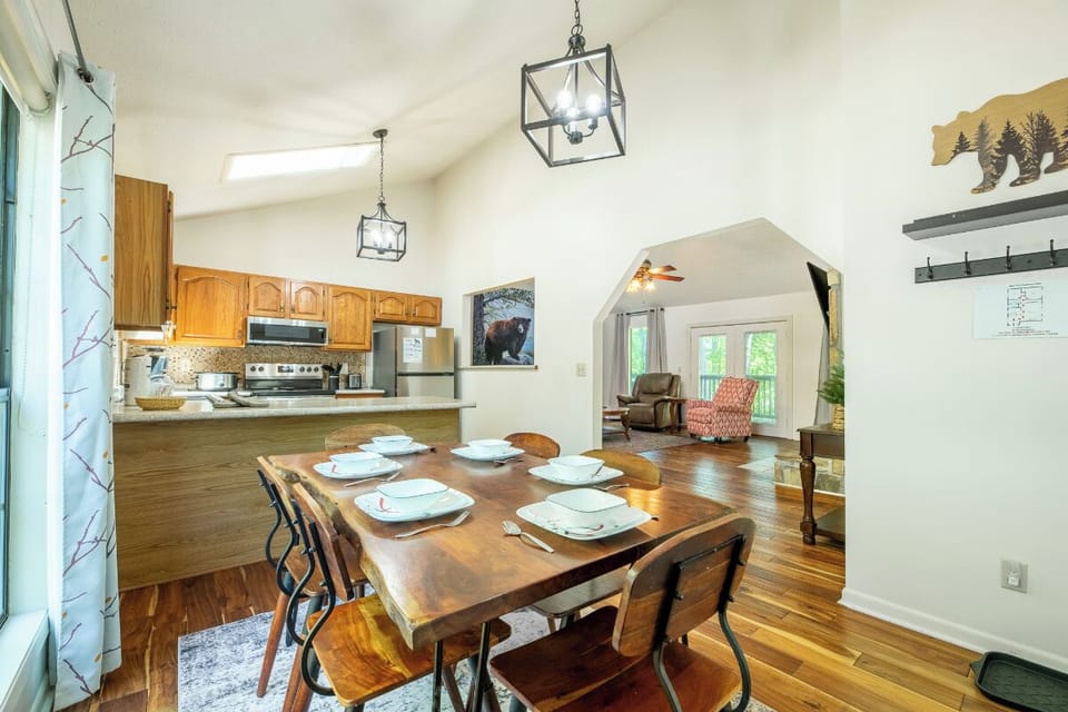 Gather around your rustic dining table for memorable meals, with warm wood finishes and charming mountain accents creating the perfect backdrop for togetherness.