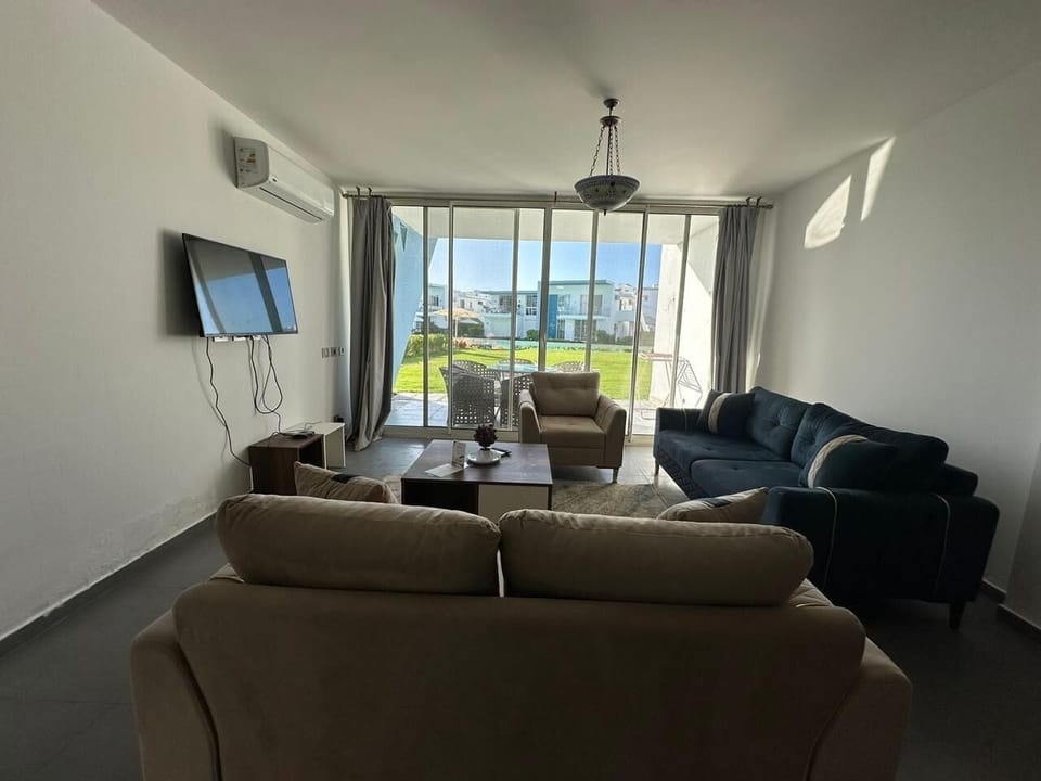 Chalet, 3 Bedrooms, Lagoon View | Living area | Flat-screen TV