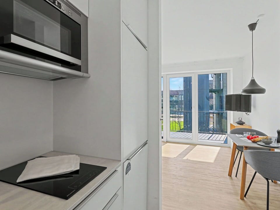 Interior Design, Kitchen, Flooring, Countertop, Floor, Wood, Furniture, Cabinetry, Ceiling, Apartment
