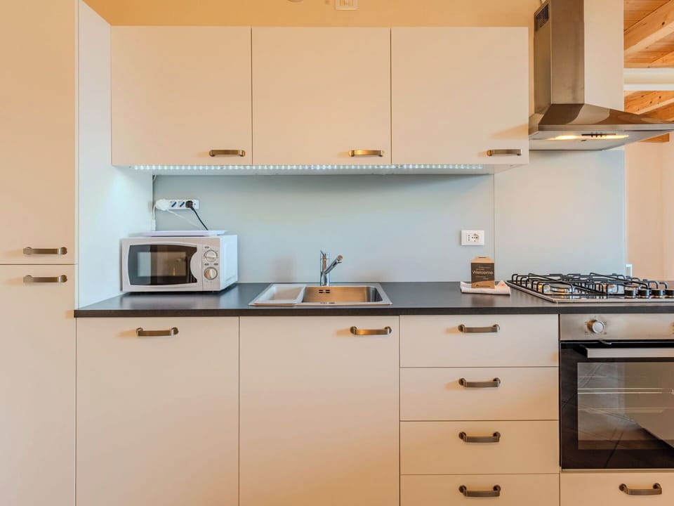 Kitchen, Countertop, Kitchen Appliance, Cabinetry, Major Appliance, Interior Design, Wood, Flooring, Kitchen Stove, Furniture