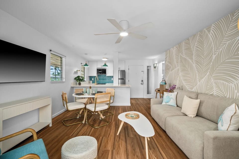 Bright, airy space where coastal vibes meet comfort. Relax on the plush sofa, gather at your dining table, and prepare meals in a modern kitchen designed for your stay.