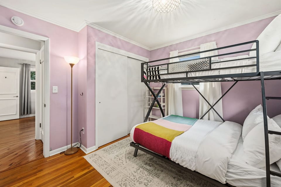 Cozy bedroom features a twin-over-full bunk bed.