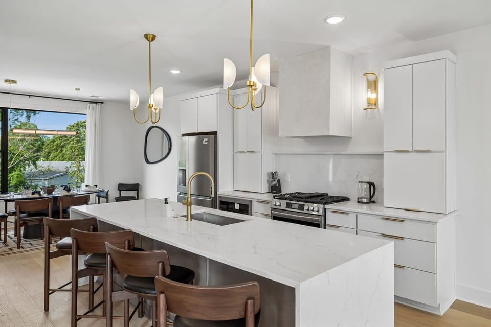 Kitchen: Fully equipped kitchen with modern appliances, cookware, and ample counter space—perfect for preparing meals or enjoying a quick breakfast before heading out.