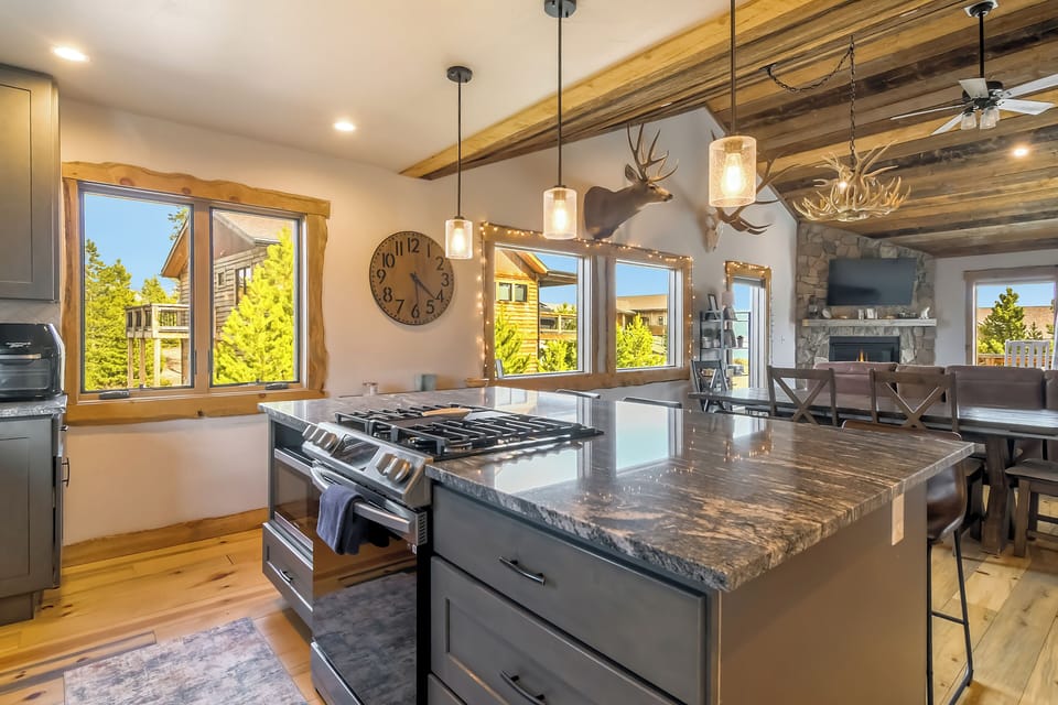 Your gourmet kitchen features granite countertops, stainless steel appliances, and rustic wood beams creating the perfect space for culinary adventures.