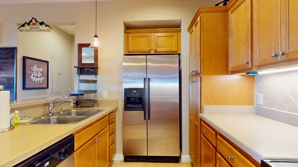 Your fully equipped kitchen features stainless steel appliances and ample cabinet space for preparing meals during your mountain getaway.