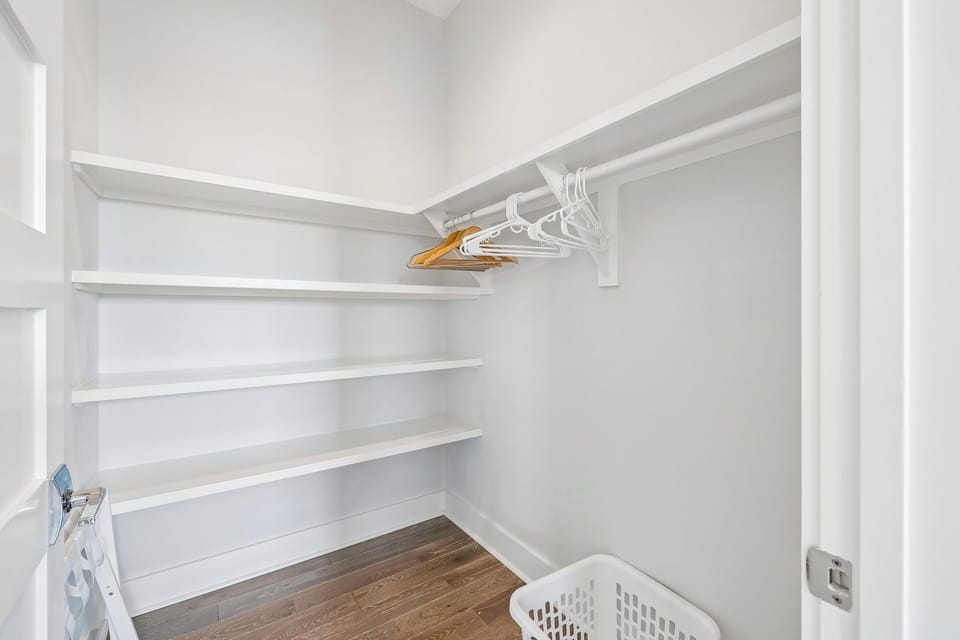 Your own walk-in closet with shelving and a hanging rod keeps everything organized, so you can unpack and settle in with ease.