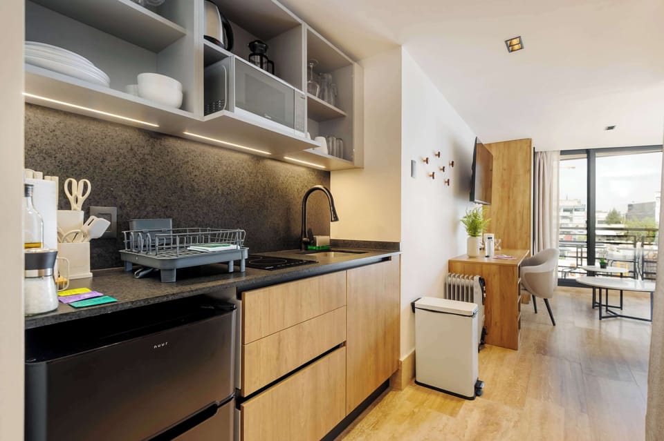 Fully equipped kitchen with natural light and modern design.