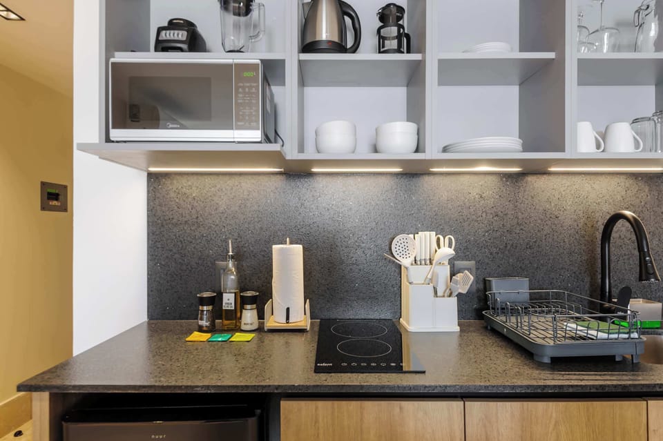 Modern kitchen with touch-control induction cooktop for safe and efficient cooking.