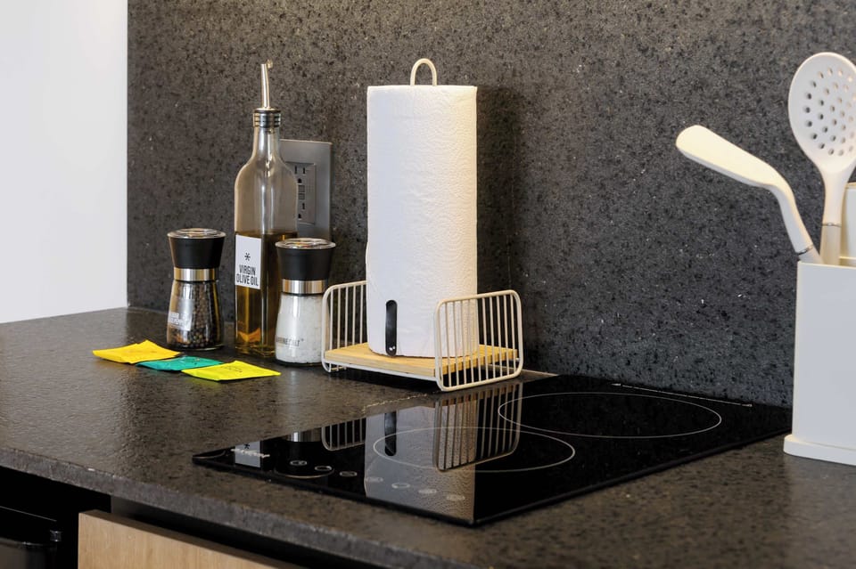 Sleek kitchen featuring a smart induction stove with fast heating and easy controls.