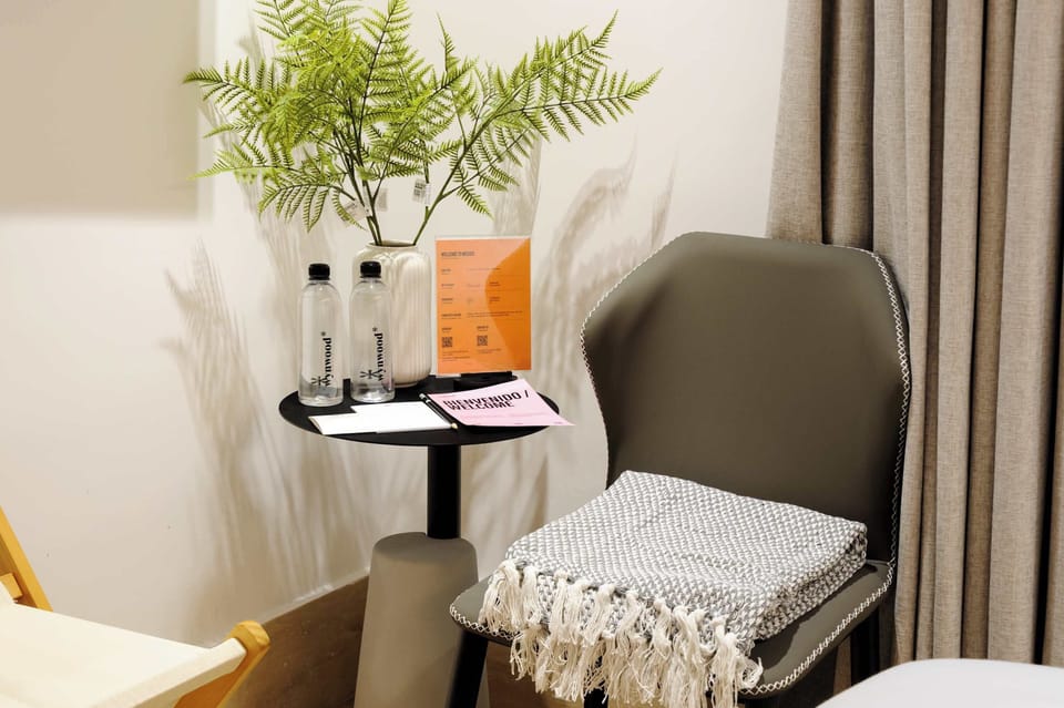 Relaxing reading corner with chair and soft textures.