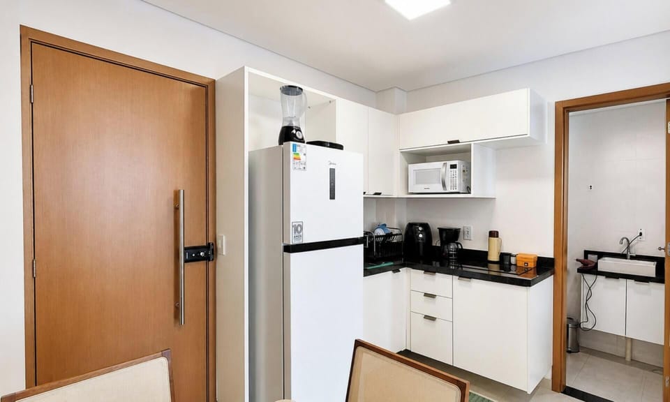 Premium Apartment, Pool Access | Private kitchen | Microwave, cookware/dishes/utensils, dining table