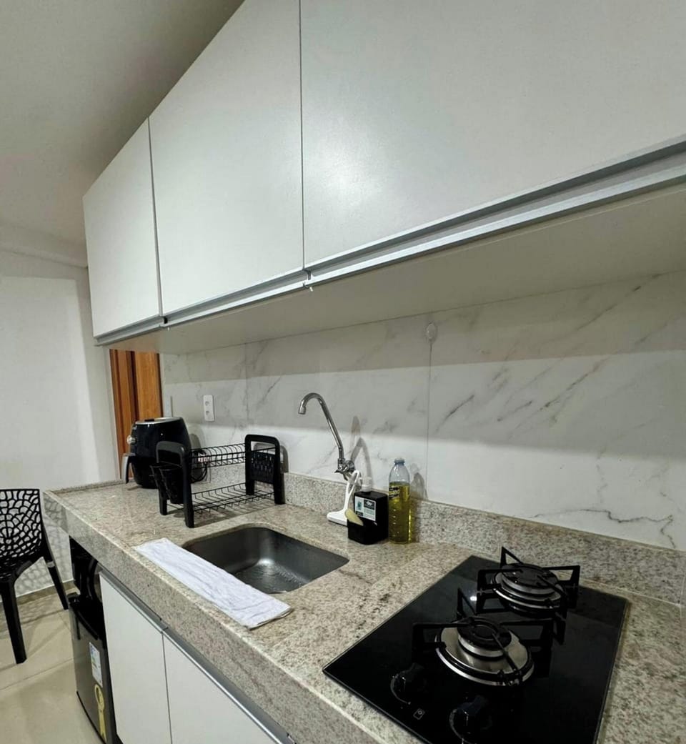 Deluxe Apartment, Pool Access, Sea View | Private kitchen | Fridge, microwave, cookware/dishes/utensils, dining tables