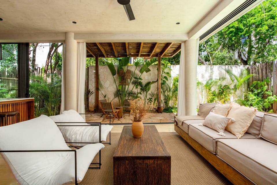 The living room is spacious and features comfortable sofas, perfect for spending quality time with your group or family