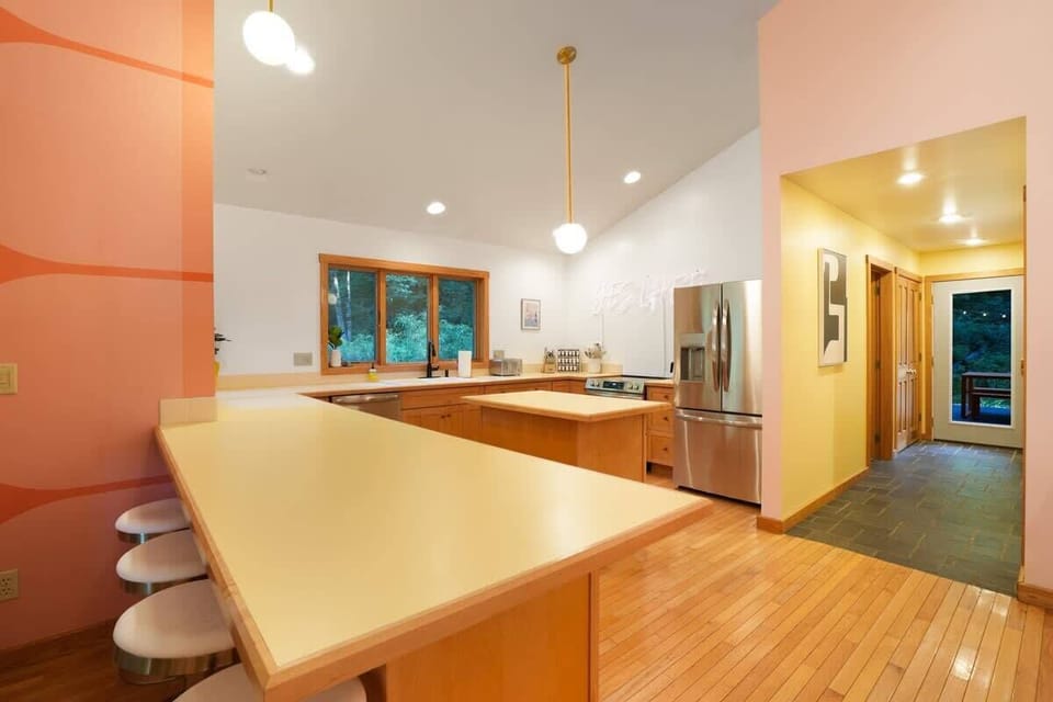 Kitchen: Vibrant space to whip up culinary delights with modern appliances and inviting views!