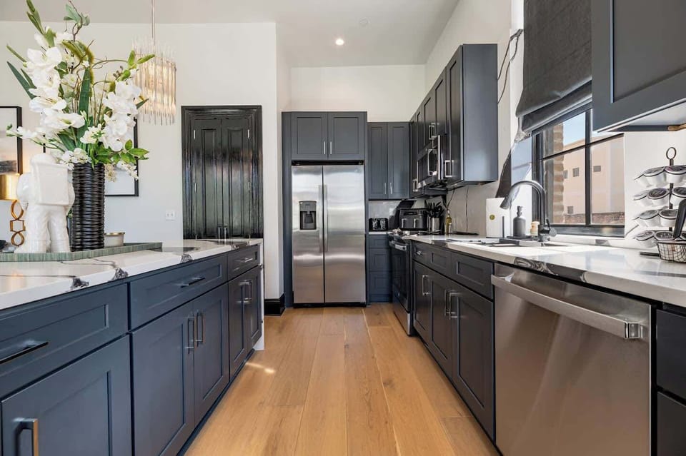 Living / Dining Area. Fully stocked kitchen with island and counter dining for four. Table dining for eight. Queen-size sleeper sofa.