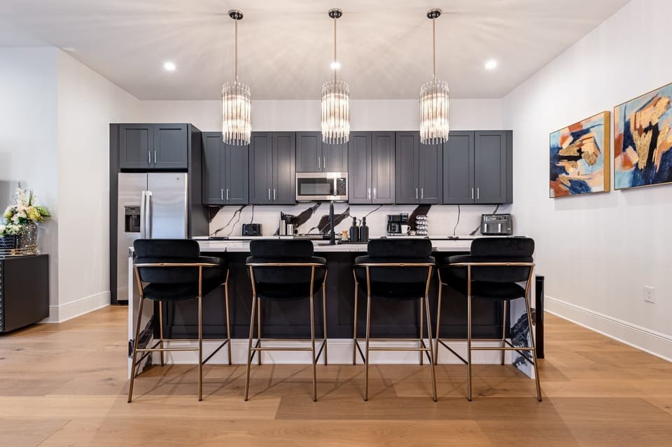 Fully stocked kitchen. Island with counter seating for four.