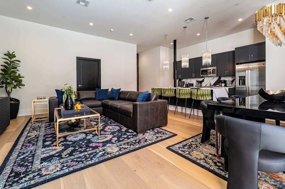 Living Room opens up to pool. Features queen-size sleeper sofa.