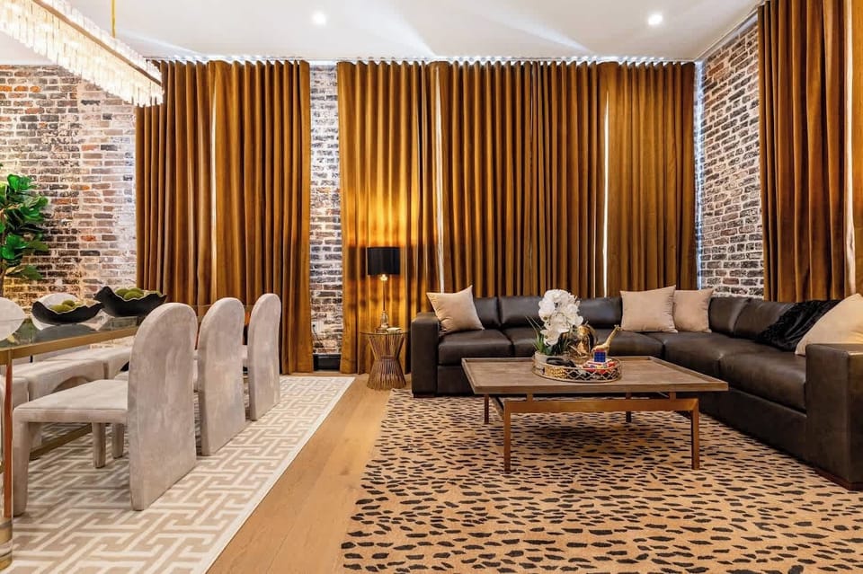 Living, dining, and kitchen area. Fully stocked kitchen. Table seating for six, counter seating for four, queen-size sleeper sofa.