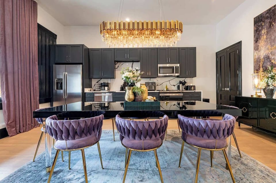 Living / Dining Area. Dining table seating for eight and queen sleeper sofa.