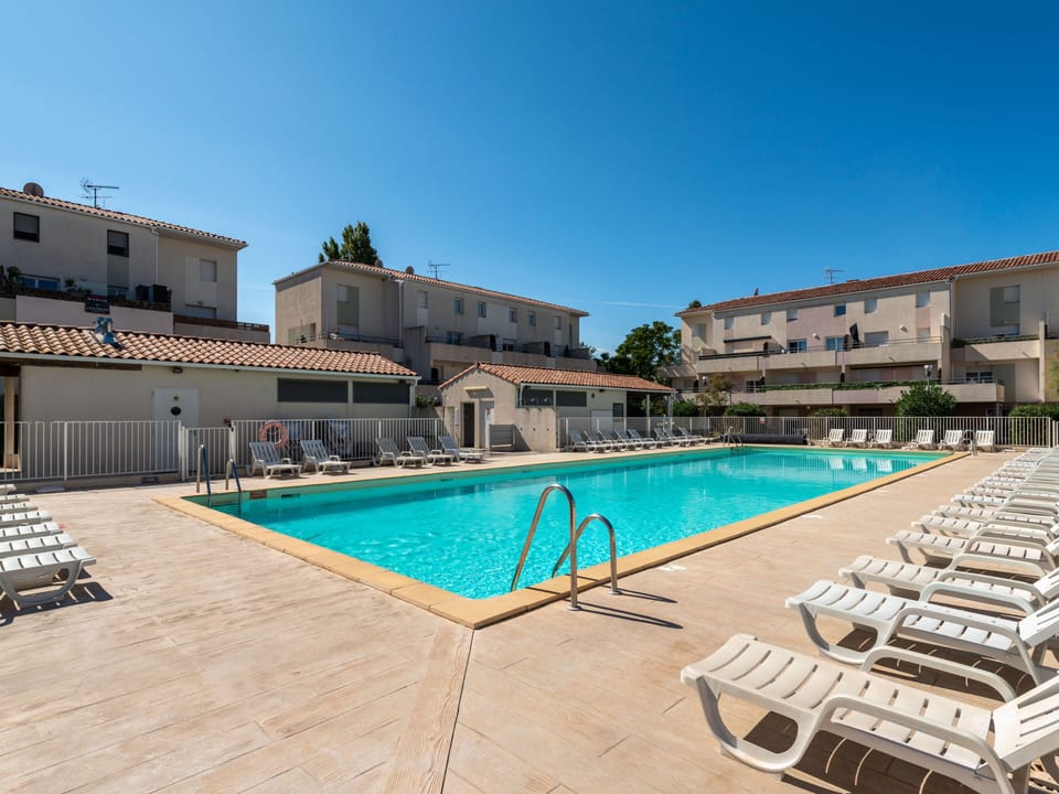 Dive into relaxation in the sunlit pool.