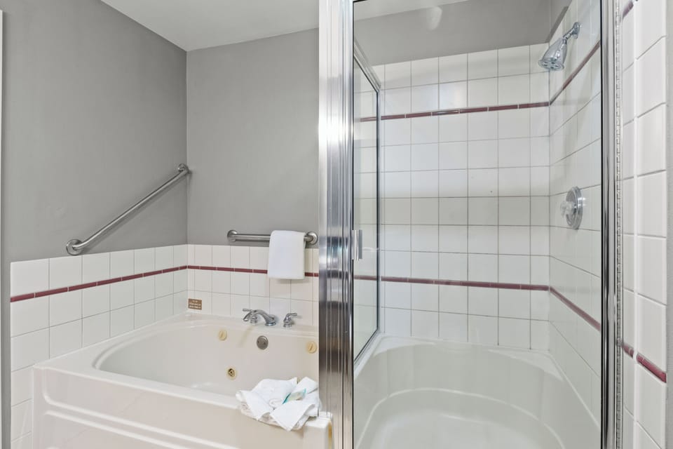 Separate tub and shower, hair dryer, towels, soap